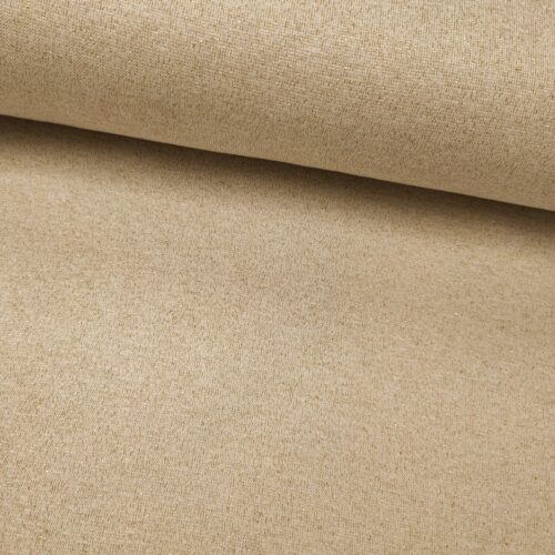 Beige, hieman kimaltava kangas rullalla lähikuvassa.